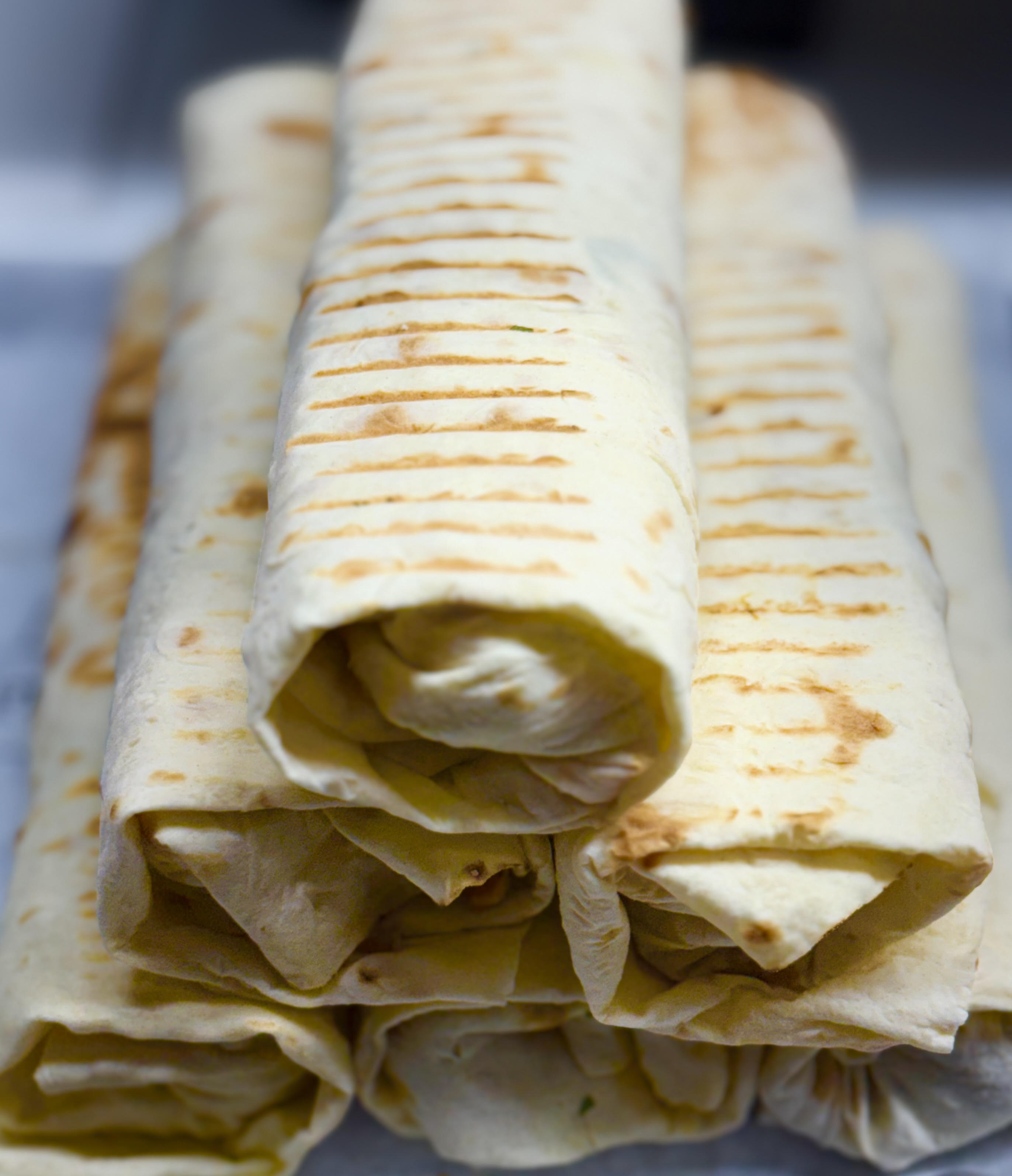 Shawarma spin. Cooked, sliced, sauced, stacked to order.
