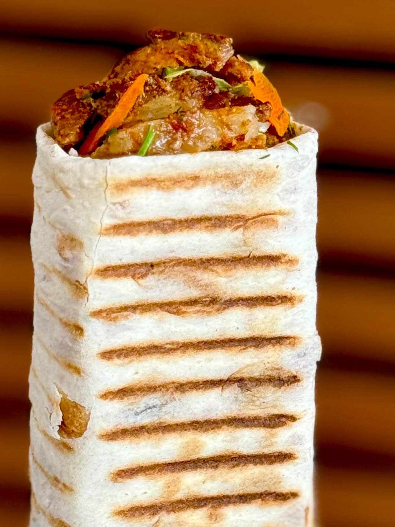 Wrap station. Lavash loaded and rolled to go.